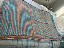 Handmade crochet throw. Made for enjoyment with self striping yarn