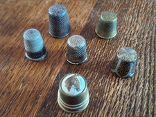 6 Vintage thimbles including