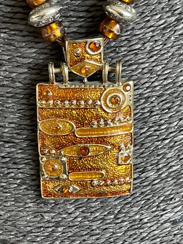 Amber tone enamel pendant