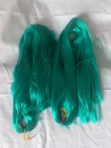 Doll hair for rerooting teal