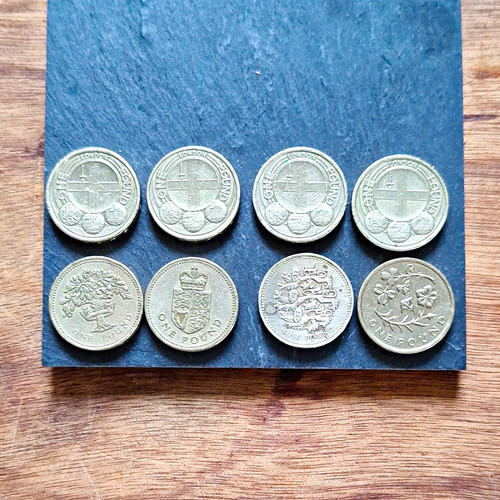 Various one pound coins - one,