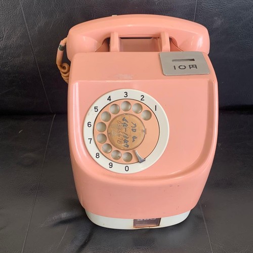 Pink rotary dial telephone