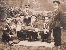 c1910 St John Ambulance Stretcher Drill RPPC British First Aid Uniform Photo