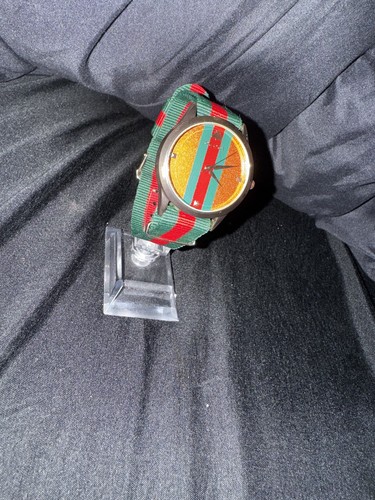 Gucci gold and silver - and, watch