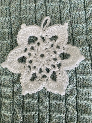 Hand crocheted snowflake - hand,
