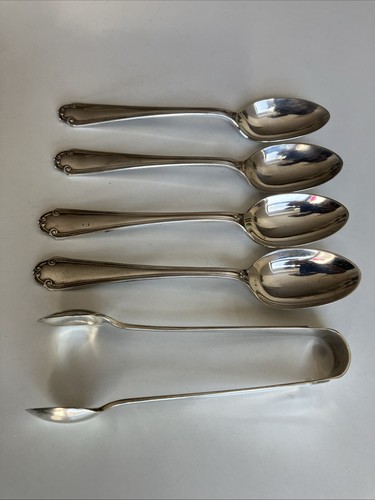 Teaspoons and sugar tongs - and,