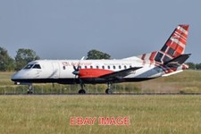PHOTO  AEROPLANE SAAB 340B 'G-LGNU' LOGANAIR C/N 223. BUILT 1990. SEEN ARRIVING