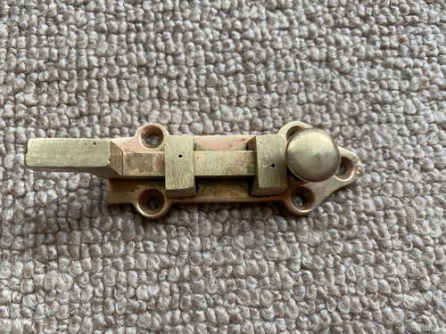 Old antique brass door bolt - old,