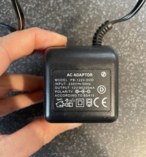 AC Adapter Model PB~1220-DVD Input 230V~50HZ Output 12V 200MA