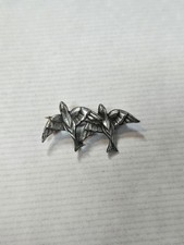Silver toned double bird brooch