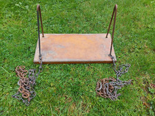 Vintage wooden garden swing with metal chain
