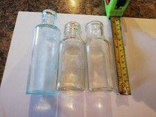 THREE VINTAGE GLASS BOTTLES TWO EMBOSSED WITH FOSTER CLARK LTD, ONE WITH MASON'S