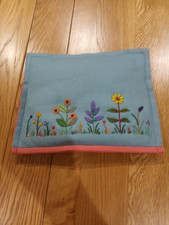 Vintage padded embroidered felt tea cosy. Pale blue with pink lining.