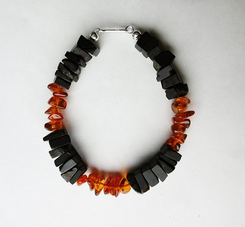 Whitby jet and amber bead - and,