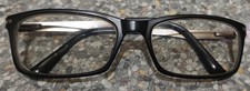Police glasses with a black frame front and silver toned arms.