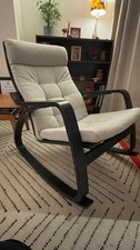 Ikea POÄNG Rocking Chair - black-brown frame with Gunnared beige cushion.