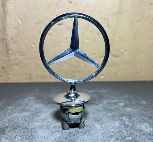 Front hood ornament mounted - ornament,
