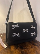flap over bow shoulder bag