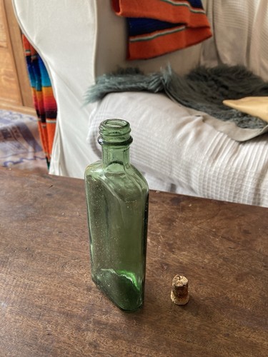 Vintage green glass bottle