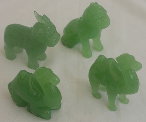 Green glass statues - x,