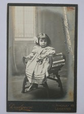 CABINET CARD OF GIRL SAT IN