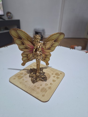 Golden toned fairy figurine - golden-toned,