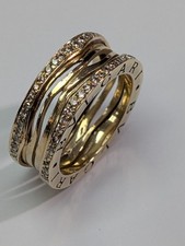 14CT GOLD AND DIAMOND TWISTED PUZZLE STYLE RING - SIZE N 1/2
