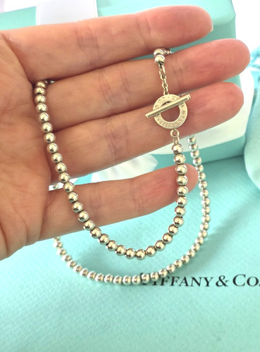 Tiffany logo circle - &,
