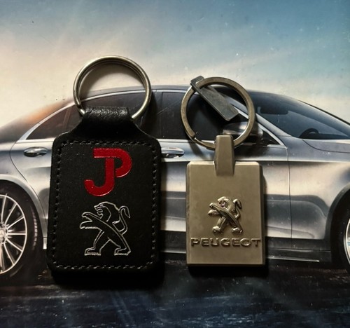 Two genuine peugeot keyrings - two,