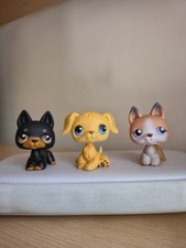 Littlest Pet Shops doberman, golden retriever, and german shepherd dogs.