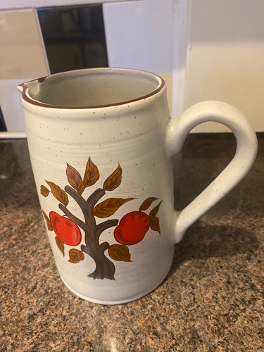 Stoneware jug featuring - , red