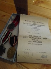 3 German War Medals with original certificate and bag