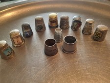 THIMBLE ODDITIES AS PER PHOTO.
