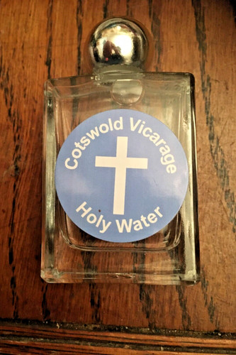 Bottle and holy water blessed - and,