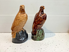 A Pair of bone china BENEAGLES Scotch Whisky EAGLE decanter figurines, empty