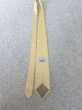 A Vivienne Westwood Shiny Yellow Tie.