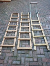 Wooden roof ladder with roof hook with wheels