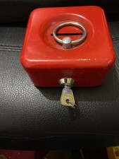 Sm metal cash box with coin slot and key still attached. In Good condition