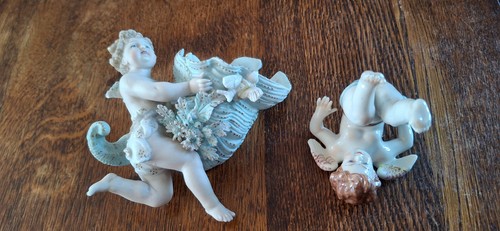 Capodimonte tumbling putti - , and