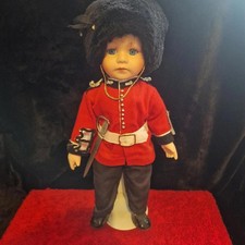 British Royal Guard Porcelain Doll – Red Uniform, Bearskin Hat & Sword