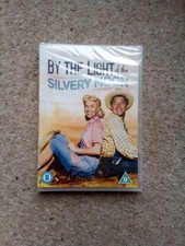 BY THE LIGHT OF THE SILVERY