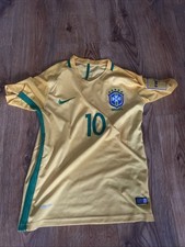 Yellow Brazil jersey with green trim and blue shorts worn by Neymar in 2018.