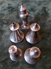 Five antique silver Pepperettes and salt shakers. One matching pair