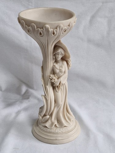 Carved cream coloured lady and - coloured,