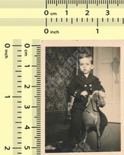 Boy riding rocking horse kid - boy,