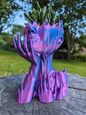 Head planter, Melted head