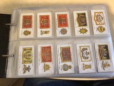 COLLECTION OF 13 COMPLETE SETS OF CIGARETTE CARDS IN ALBUM - MILITARY THEME