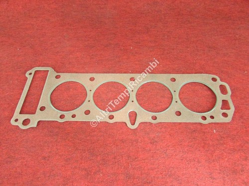 Cylinder head gasket with - head, a