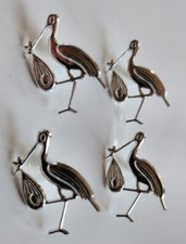 4 x Silver Storks carrying a