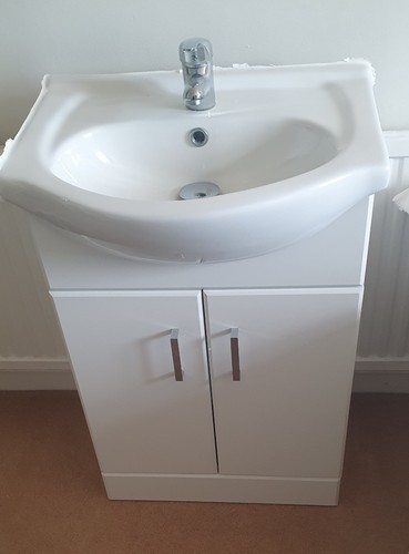 Unused small white sink - unused,